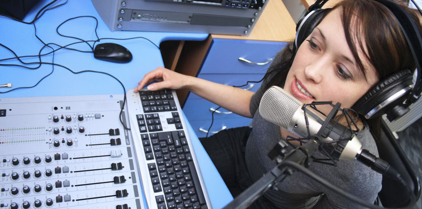 Mass communication student lives broadcast or records audio in a studio