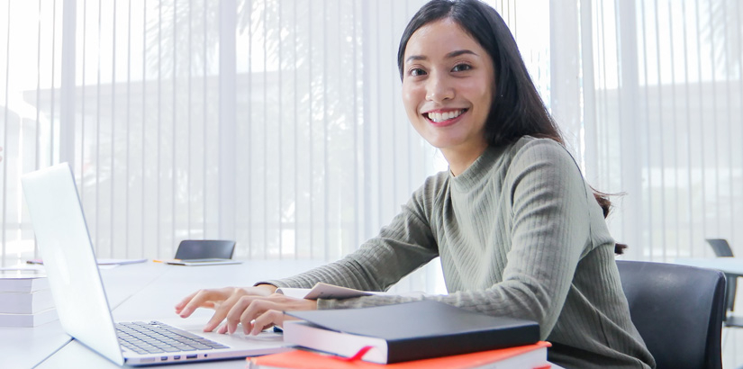 UCSI Micro-Credentials Student is working on laptop